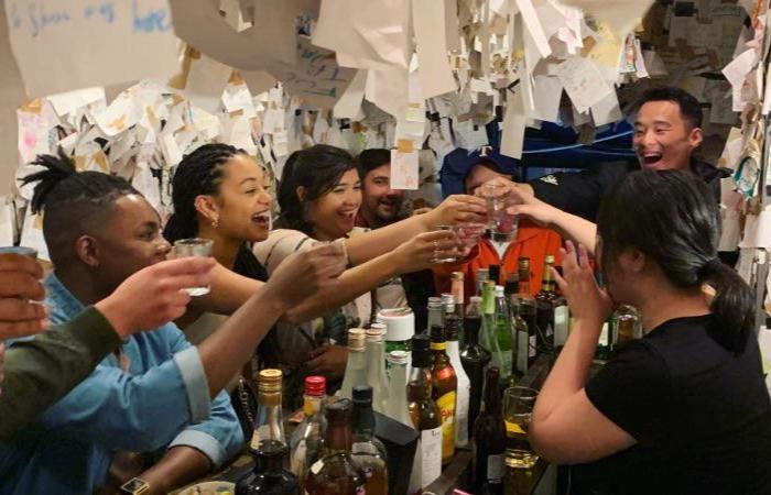 A group of young people drinking together